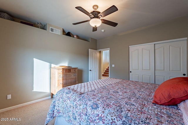 bedroom featuring carpet floors, ceiling fan, and a closet