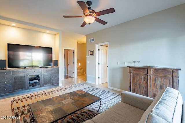 tiled living room with ceiling fan