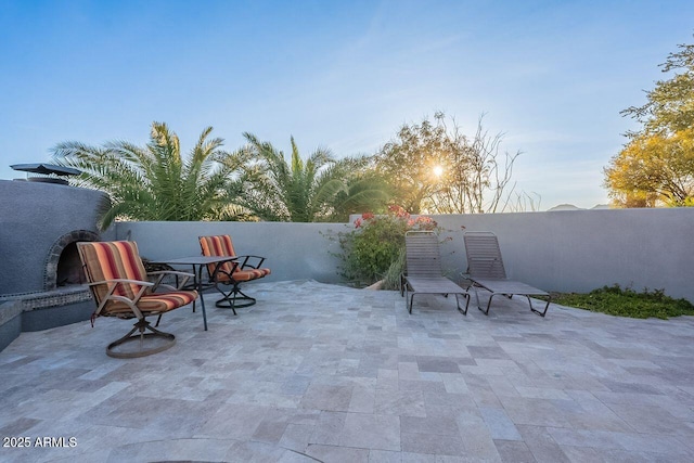 view of patio terrace at dusk