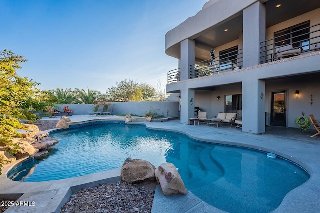 view of swimming pool with outdoor lounge area and a patio area