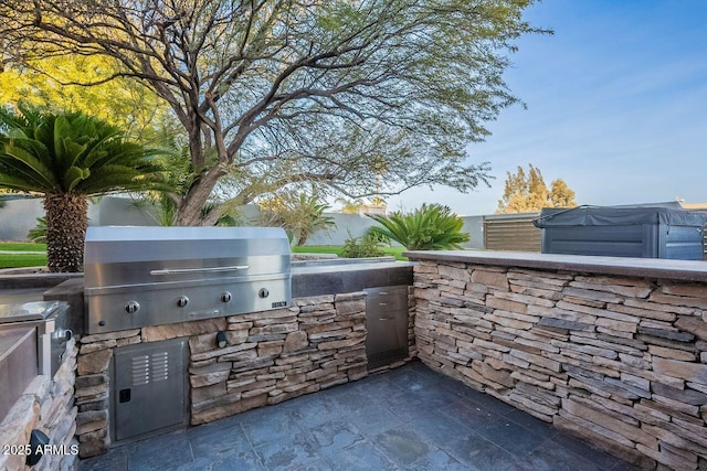 view of patio with area for grilling and grilling area