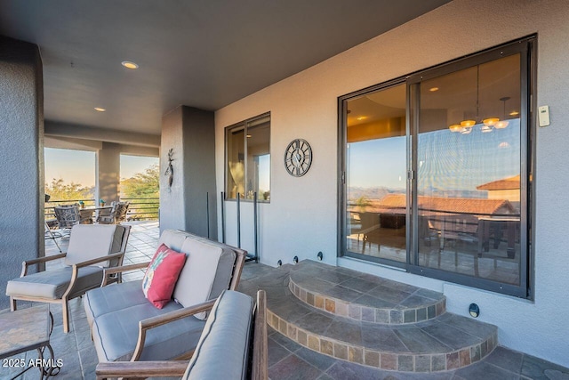 patio terrace at dusk with a balcony