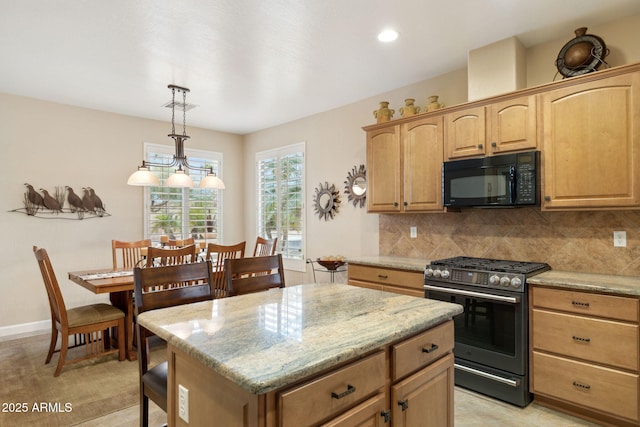 kitchen with stainless steel gas range, a kitchen island, light brown cabinetry, black microwave, and tasteful backsplash