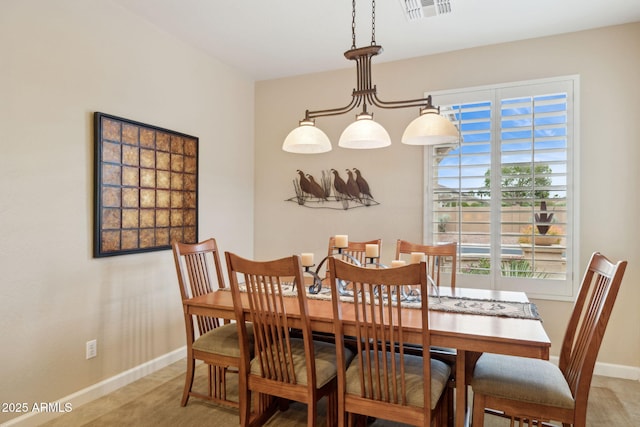 dining room with baseboards and visible vents