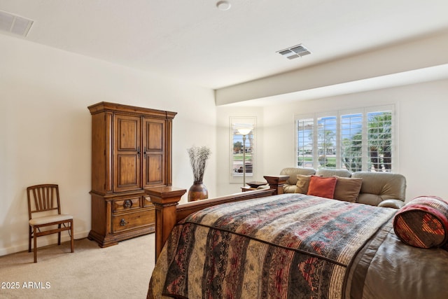 bedroom featuring light carpet, visible vents, and baseboards