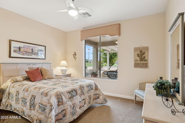 bedroom featuring baseboards, visible vents, carpet floors, and ceiling fan