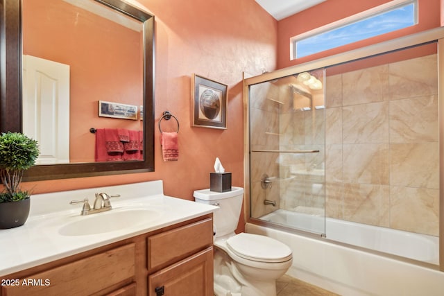 full bathroom with vanity, toilet, tile patterned flooring, and enclosed tub / shower combo