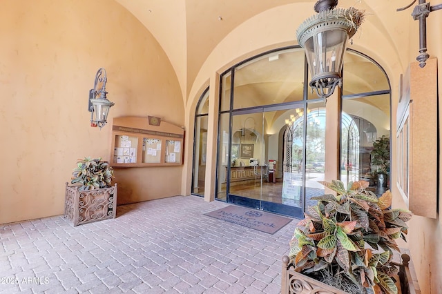 entrance to property with stucco siding