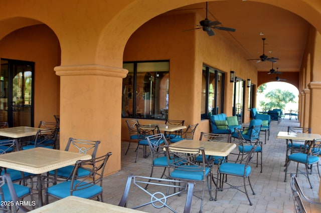 view of patio / terrace with ceiling fan and outdoor dining space