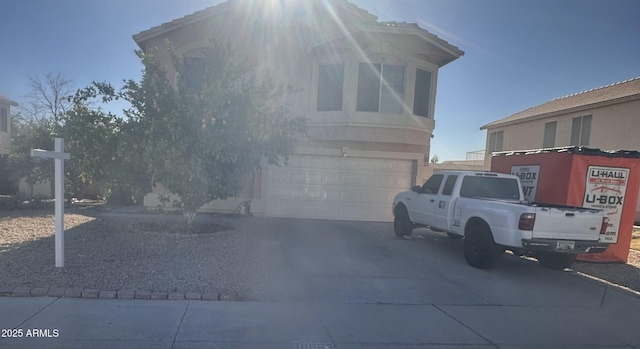 exterior space featuring a garage and concrete driveway