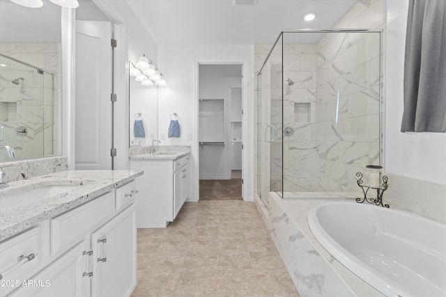 bathroom with vanity and plus walk in shower