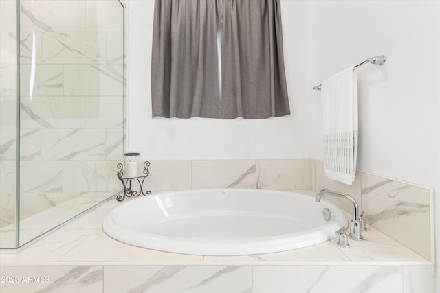 bathroom with tiled bath