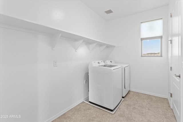 laundry area featuring washing machine and clothes dryer