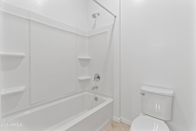 bathroom with tile patterned floors, tub / shower combination, and toilet