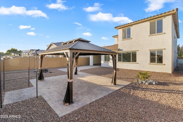 exterior space with a gazebo and a patio