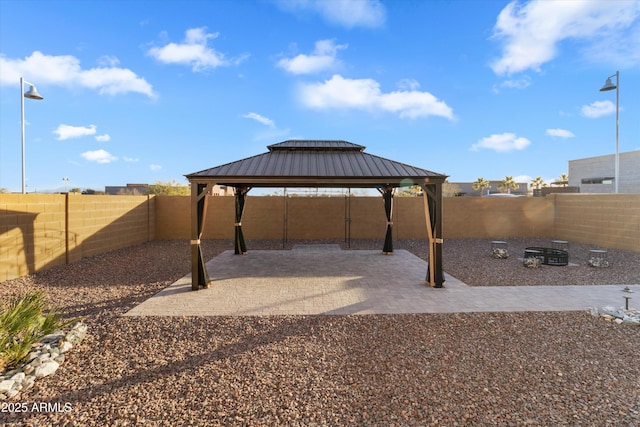 view of patio / terrace with a fire pit and a gazebo