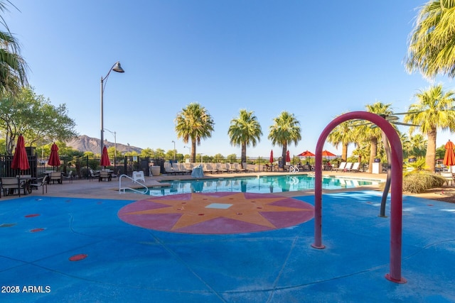 view of swimming pool featuring a mountain view