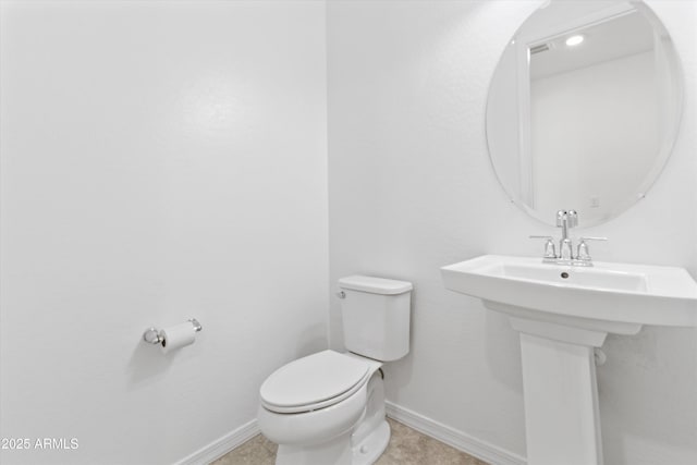 bathroom featuring sink and toilet