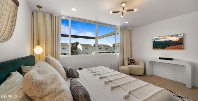 bedroom featuring recessed lighting and wood finished floors