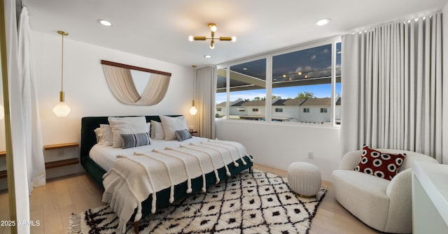 bedroom featuring recessed lighting and wood finished floors