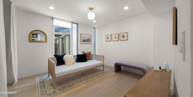 living area with recessed lighting and light wood-type flooring