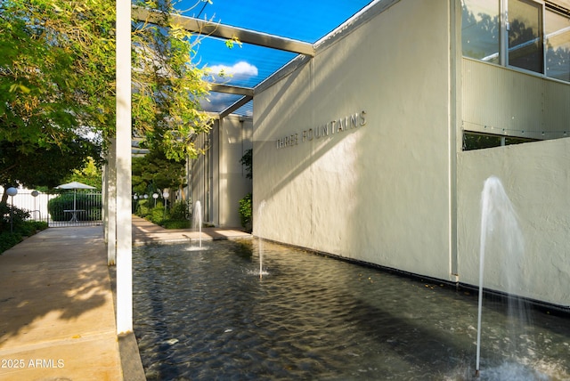 view of side of property with fence