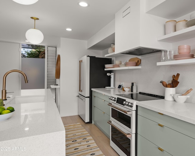 kitchen featuring a sink, premium range hood, open shelves, and double oven range