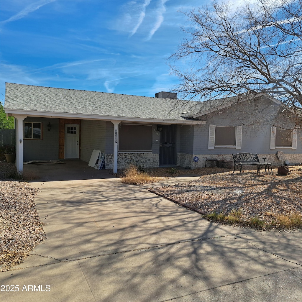 ranch-style house with a carport