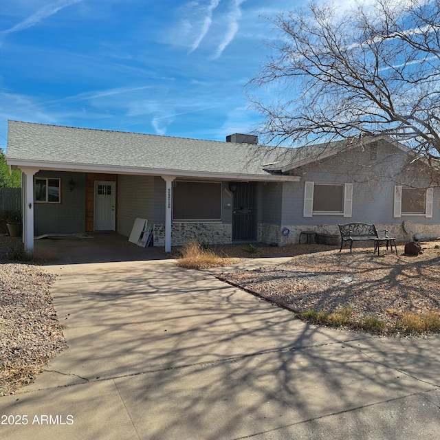 ranch-style house with a carport