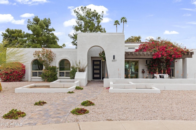 view of front of home with stucco siding