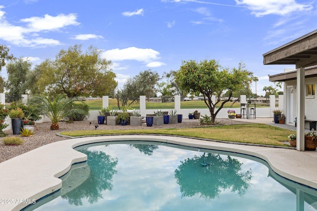 view of pool with fence and a fenced in pool