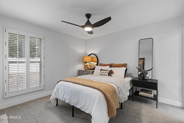 bedroom with a ceiling fan, carpet, and baseboards