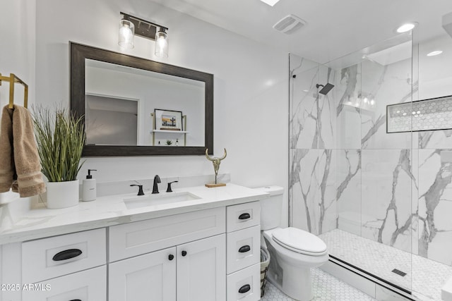 full bathroom with a marble finish shower, visible vents, toilet, and vanity