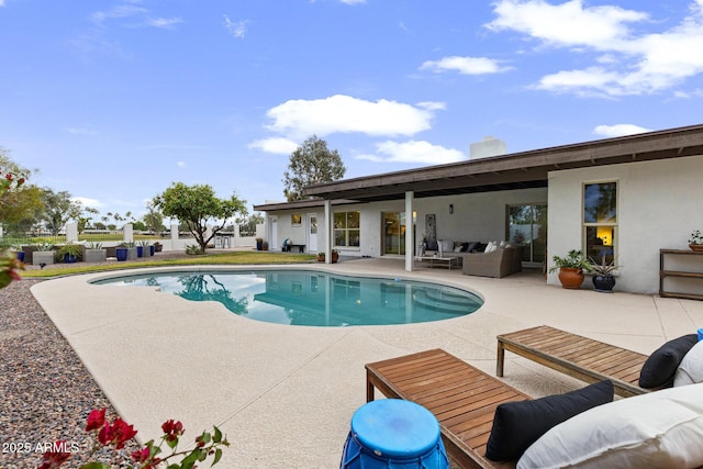 pool featuring a patio area and an outdoor hangout area