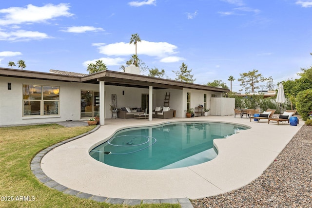 view of pool featuring outdoor lounge area, a patio, and a fenced in pool