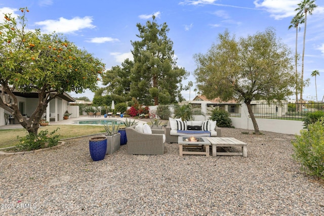 view of yard with an outdoor living space, a fenced in pool, a patio, and a fenced backyard