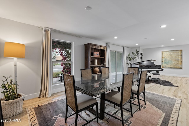 dining area with recessed lighting, light wood-type flooring, and baseboards
