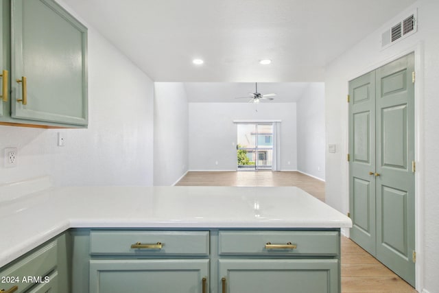 kitchen with ceiling fan, light hardwood / wood-style flooring, and green cabinetry