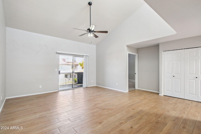 unfurnished living room featuring high vaulted ceiling, light hardwood / wood-style flooring, and ceiling fan