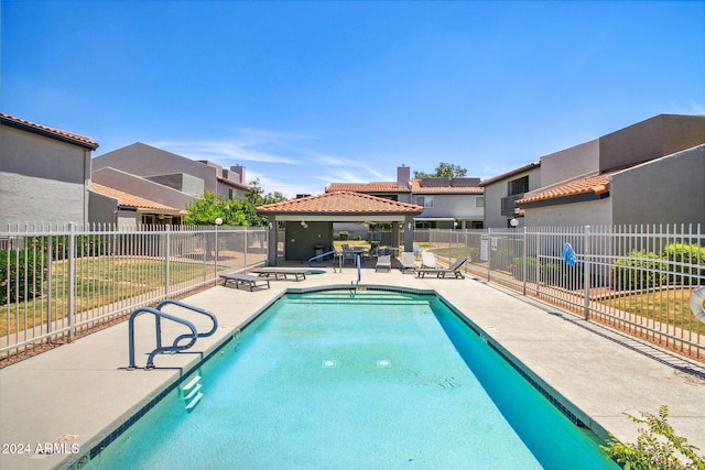 view of swimming pool with a gazebo and a patio