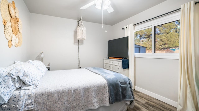 bedroom featuring dark hardwood / wood-style floors and ceiling fan