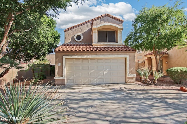 3440 E Southern Ave Unit 1042, Mesa, AZ 85204 - mediterranean / spanish-style home featuring concrete driveway, a tile roof, stucco siding, and an attached garage