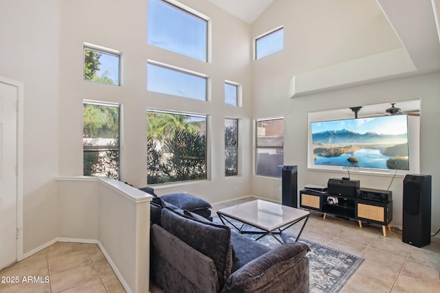 3440 E Southern Ave Unit 1042, Mesa, AZ 85204 - tiled living room featuring a towering ceiling and baseboards