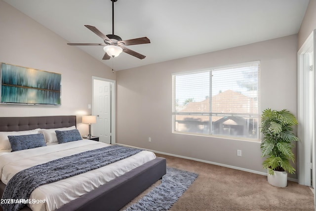 carpeted bedroom featuring lofted ceiling and ceiling fan