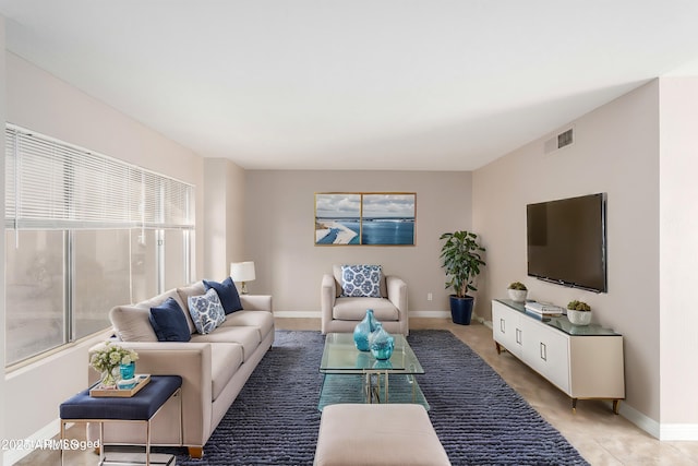 living room featuring light tile patterned flooring