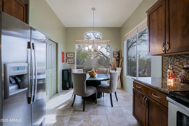 dining space with a notable chandelier