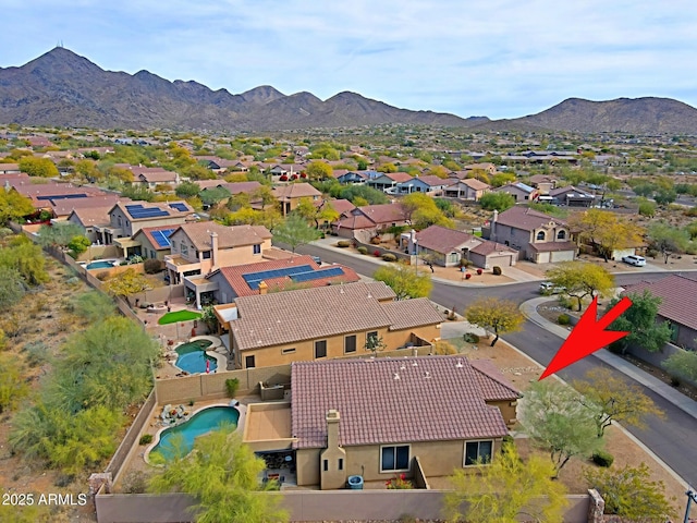 drone / aerial view with a residential view and a mountain view