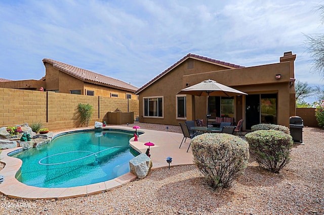 view of pool with a fenced backyard, a fenced in pool, and a patio