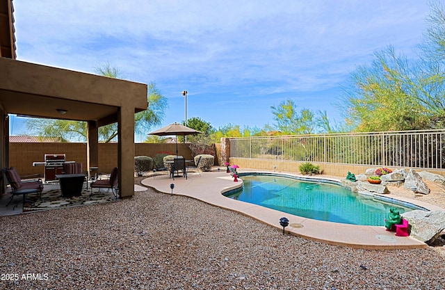 view of pool featuring outdoor dining space, a fenced backyard, a fenced in pool, and a patio