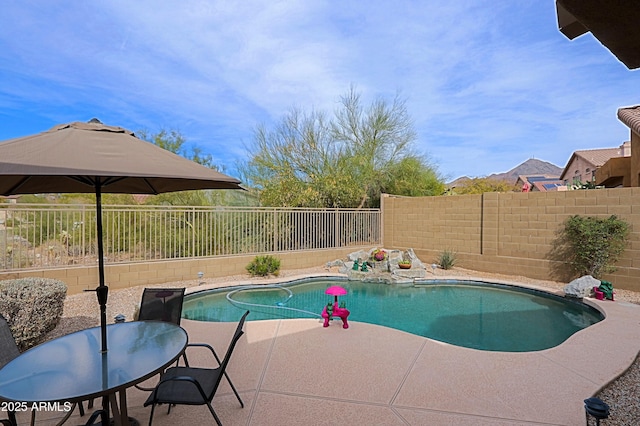 view of swimming pool featuring a patio area, a fenced backyard, and a fenced in pool